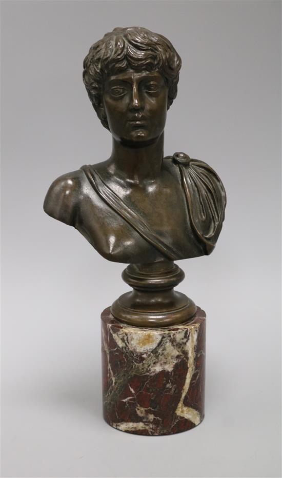 A bronze bust of an emperor, on red marble socle height 30cm